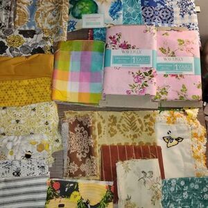 Bundle of fabric, including some lace, ribbon and other scraps for junk journals